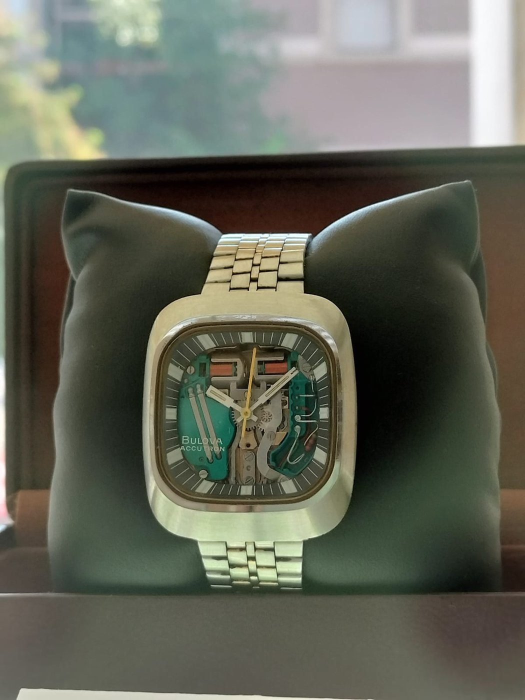 Figure 2 — 2 — A Bulova Accutron "Spaceview" on the Caliber 214 movement: the skeletonised dial deliberately shows the electronics, the twin coils, and the steel tuning fork that replaces a balance w…